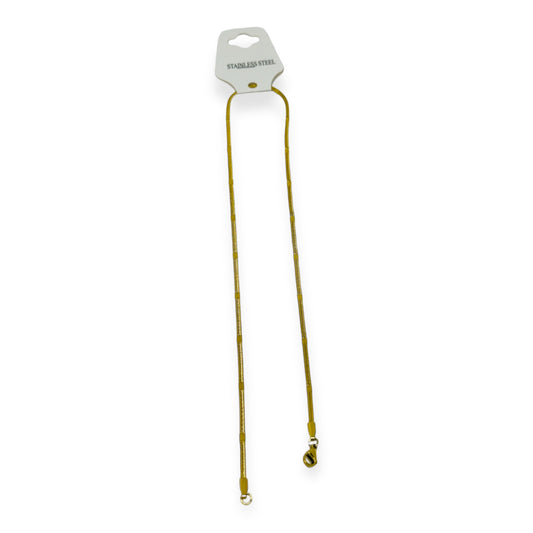 Cadena figura dorada